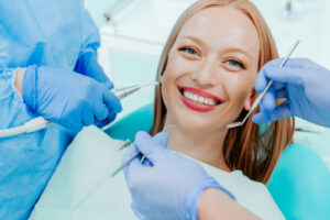 a smiling patient about to receive a dental exam